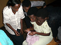 Rwanda Knits teachers learning a new scarf technique, Negasambu
