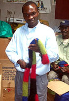 Men assisted in finishing the scarves by attaching fringe and brushing up the mohair fibers on the scarves