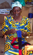 Part of the scarf finishing process is weaving in the yarn ends and attaching fringe